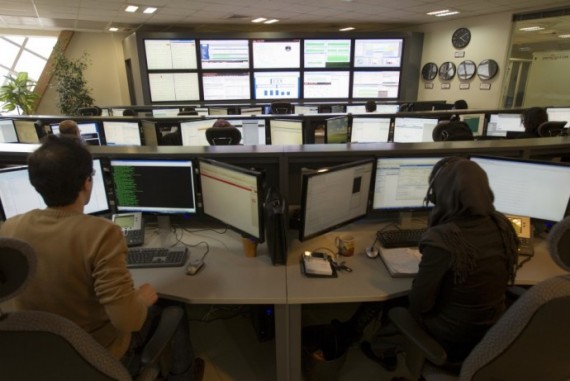 Technicians monitor data flow in the control room of an internet service provider in Tehran . Technicians monitor data flow in the control room of an internet service provider in Tehran .